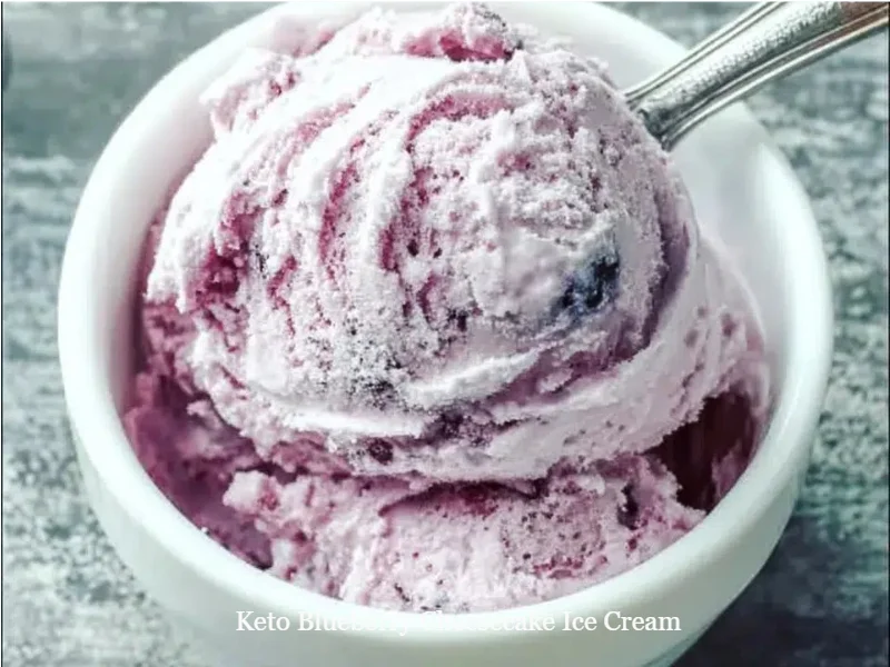 Delicious Keto Blueberry Cheesecake Ice Cream in a bowl, topped with fresh blueberries