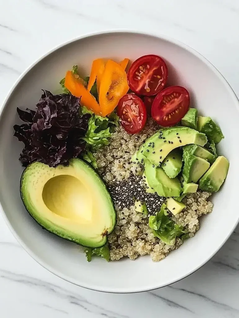 Quinoa salad with avocado slices and chia seeds in a colorful bowl
