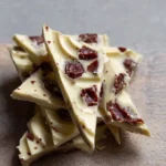 Delicious yogurt bark topped with fruits, a refreshing frozen snack for summer.