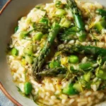 Delicious creamy asparagus risotto served in a bowl, ideal for spring dinners.