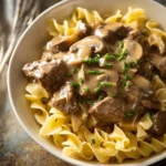 Delicious Beef Stroganoff served with creamy sauce and pasta.