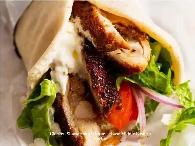 Delicious homemade chicken shawarma served with fresh vegetables and sauce