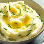 Creamy mashed potato served in a bowl, ultra-buttery recipe for perfect texture.