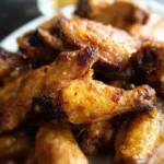 Crispy oven baked chicken wings ready to be served on a platter