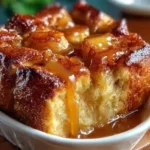 Delicious croissant bread pudding topped with caramel sauce