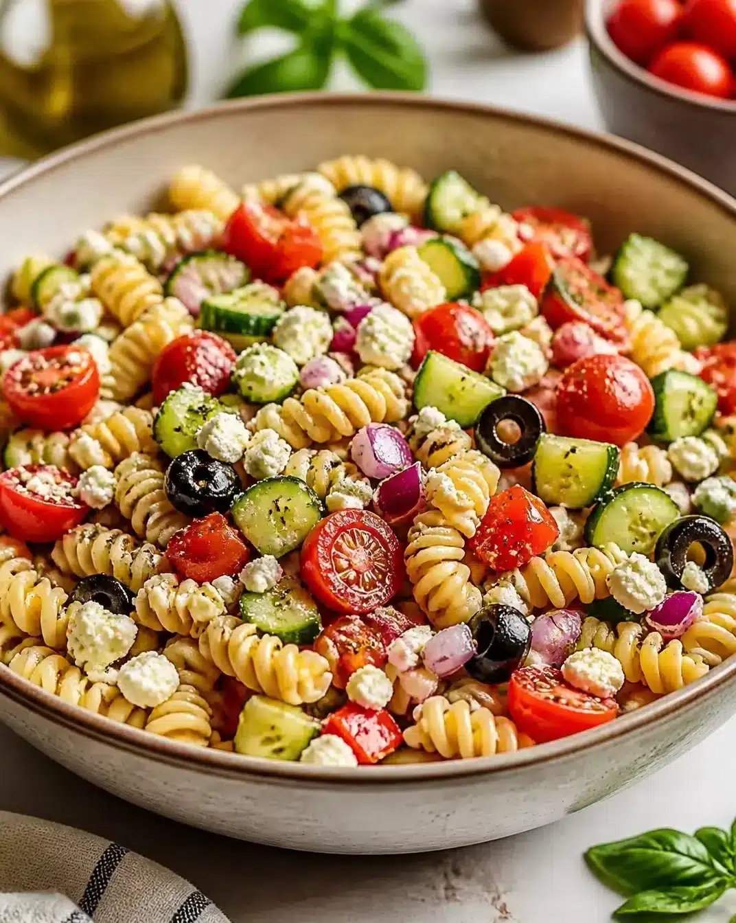 Colorful and fresh pasta salad with vegetables, perfect for summer gatherings.