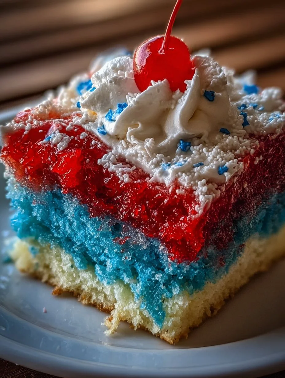 Delicious Red, White, and Blue Poke Cake decorated for summer celebrations