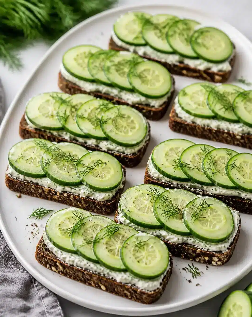 Refreshing Cucumber Sandwiches 1 Delicious and refreshing cucumber sandwiches on a plate