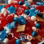 A colorful Stars and Stripes Candy Salad featuring red, white, and blue candies.
